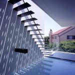 photograph of a minimalist staircase over a pool of water