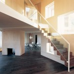 interior of a house with a fireplace and a staircase