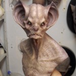 bust sculpture of a bat-like montser with gigantic ears