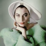 photograph of ava gardner in a white hat and green coat