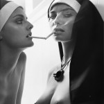 jessica hart and lydia hearst dressed as nuns, smoking and topless