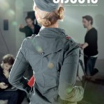 photograph of a magazine cover featuring the back of a model