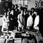 photograph of design studio staff wearing white lab coats