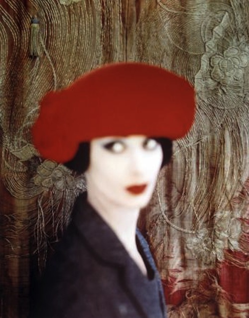 portrait of a model in a red hat, out of focus