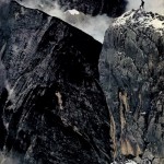 photograph of a man on dark mountain