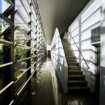 photograph of a stairwell in a corridor with louvered window
