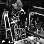 black & white on-set picture of stanley kubrick shooting a scene
