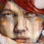 auburn haired woman with light eyes