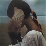 Photo of a girl listening to a sea shell by David Hamilton