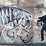 graffiti by sr. x of blindfolden man and giant bug
