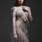 lilly cole wearing sheer white dress with black trim