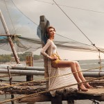 woman sitting on dock