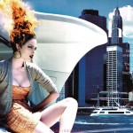 model sitting on yacht with hair on fire