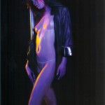 woman standing against pole