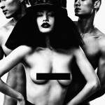 woman in hat with black bar over breasts, nude men behind her
