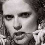 close up of woman biting hair