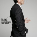 man in suit with alligator clips on back