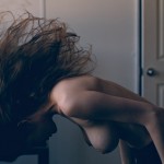 woman whipping her hair forward