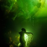 Free diver Natalia Avseenko under the Arctic ice, wrapped in fabric.