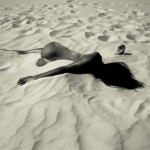 nude woman in sand