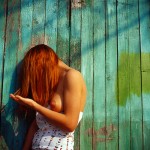 Nude at fence by Aleksey Chizhik