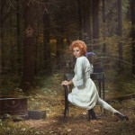 redhead woman in white dress in forest set