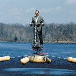 man in suit piloting heli-vector
