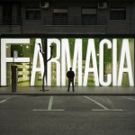 facade of refurbished pharmacy in spain with giant illuminated type