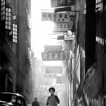 child running down chinese street, by fan ho