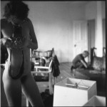 nude woman taking self portrait