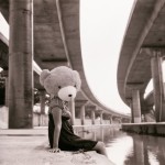 Teddy girl under a fly-over