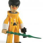 bruce lee-esque figure with green sword