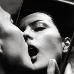 woman kissing self in mirror, by helmut newton