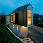 Exterior of narrow house at night