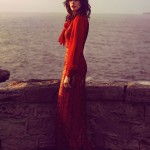 woman in red lace dress by the sea