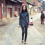 woman in suit walks in chinese street