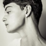 woman with short dark hair in profile