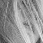 portrait of woman with hair over face
