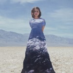 woman in death valley with mountains superimposed on dress