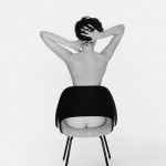 nude woman in chair