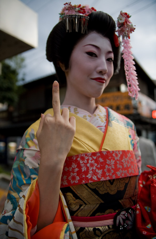 photo of a japanese woman flipping the bird