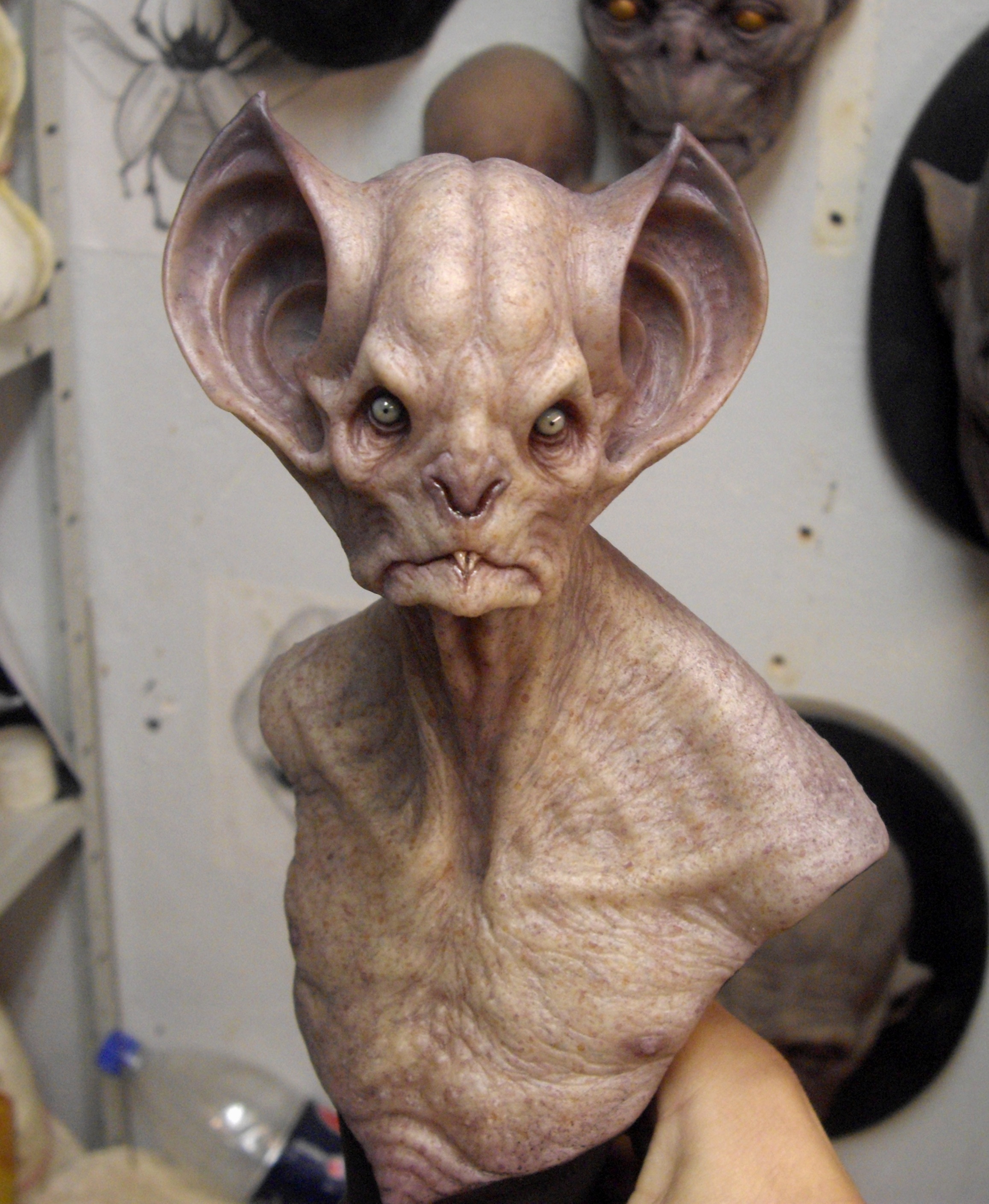 bust sculpture of a bat-like montser with gigantic ears