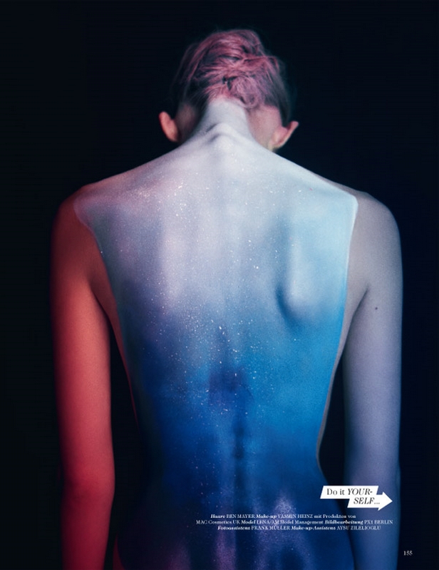 a woman's back painted in vivid colours