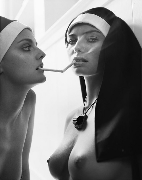 jessica hart and lydia hearst dressed as nuns, smoking and topless