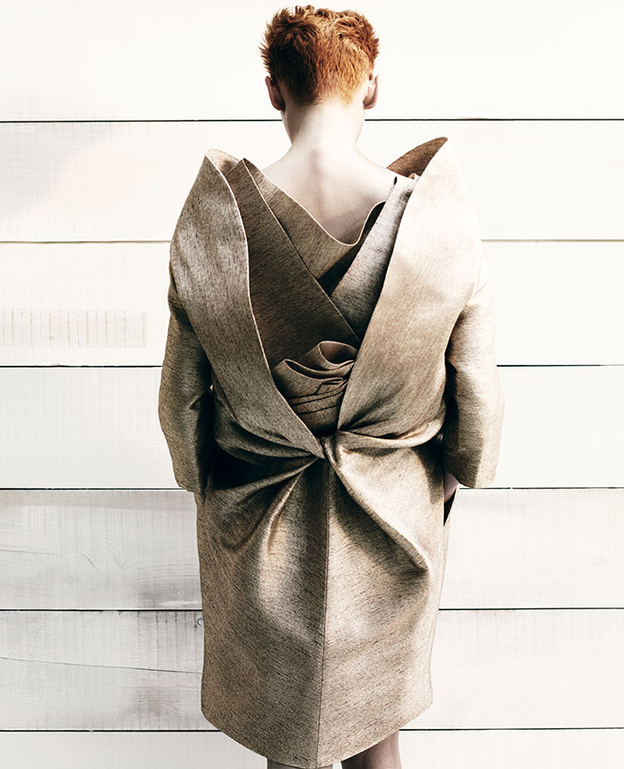 tilda swinton wearing an ornate folded gown photographed by bran adama