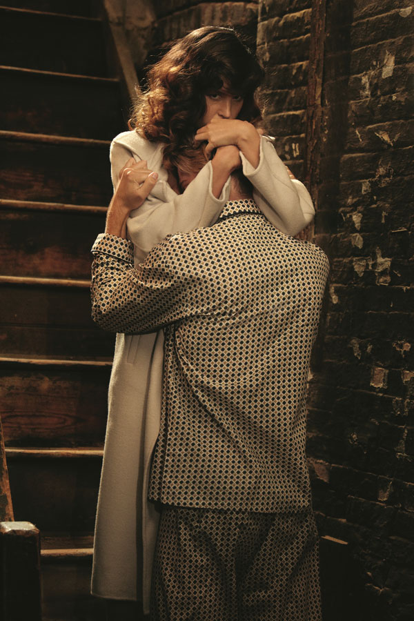photograph of a woman hugging a man