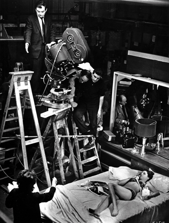 black & white on-set picture of stanley kubrick shooting a scene