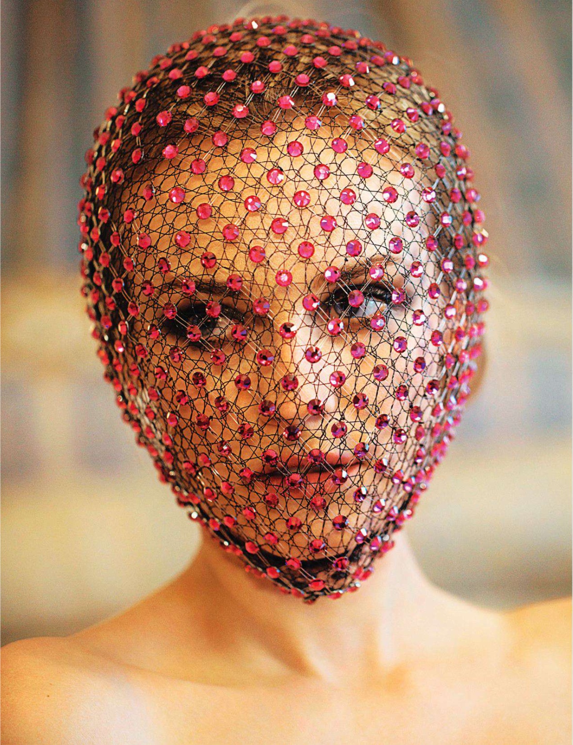 woman with red fishnet veil