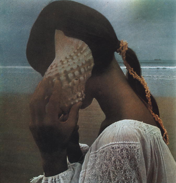 Photo of a girl listening to a sea shell by David Hamilton