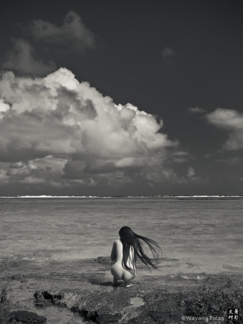nude crouching near beach